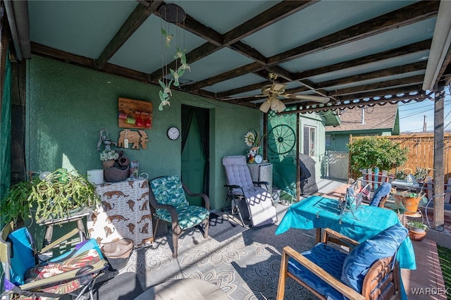 view of patio featuring fence