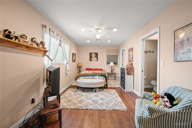 bedroom featuring recessed lighting, wood finished floors, visible vents, and baseboards