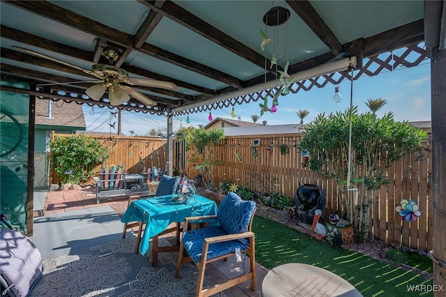 view of patio with a fenced backyard and a ceiling fan