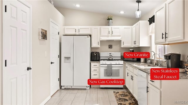 kitchen with under cabinet range hood, white appliances, and white cabinetry