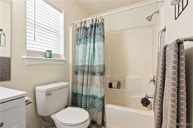 bathroom with vanity, toilet, and shower / tub combo with curtain