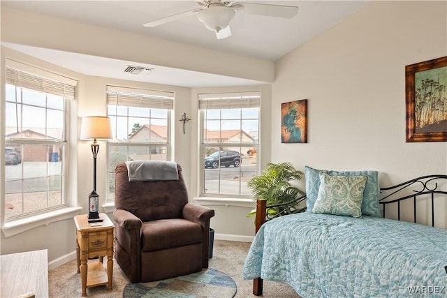 bedroom with visible vents, baseboards, a ceiling fan, and carpet flooring