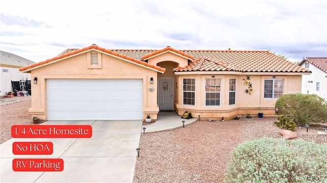 mediterranean / spanish house with a tile roof, concrete driveway, a garage, and stucco siding