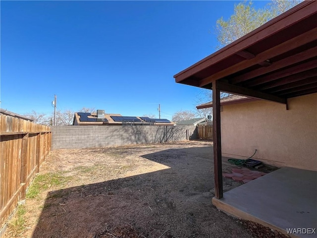 view of yard with a patio area and a fenced backyard