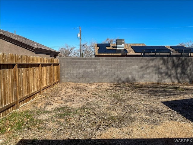 view of yard featuring a fenced backyard and cooling unit