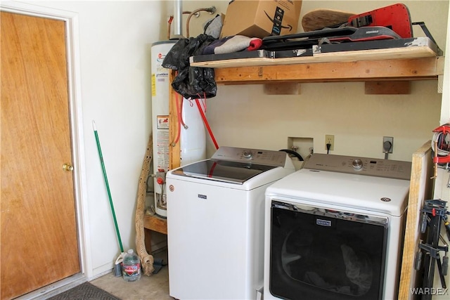 laundry area with water heater, laundry area, and independent washer and dryer