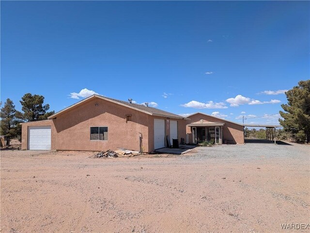view of front of property with stucco siding and an attached garage