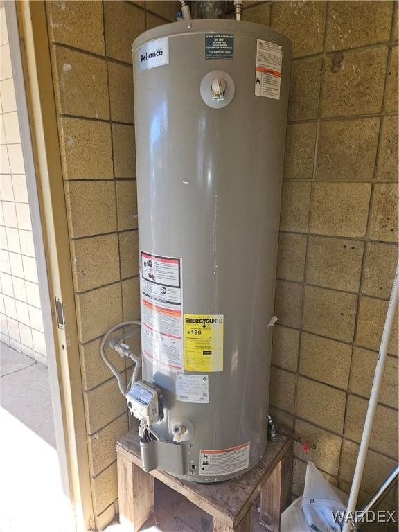 utility room with gas water heater