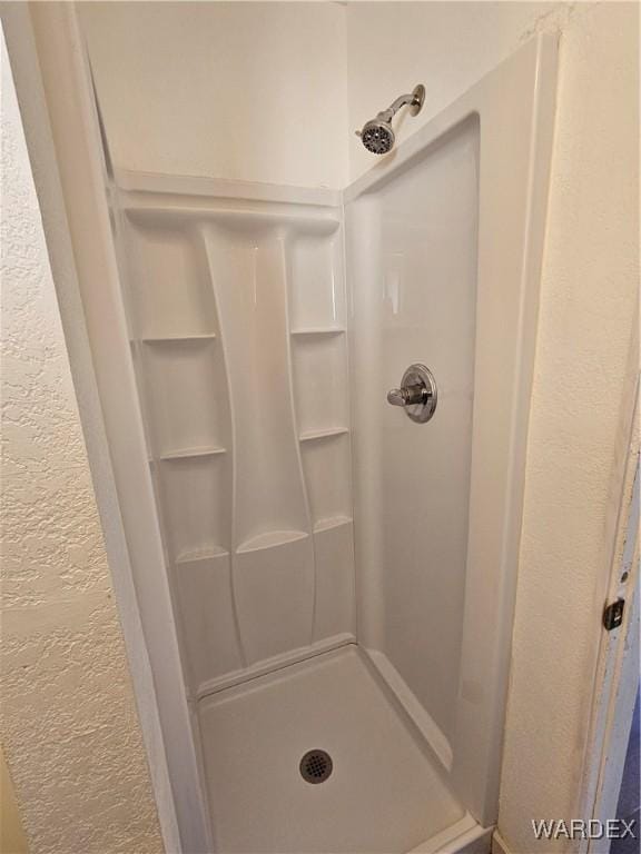 bathroom featuring a stall shower