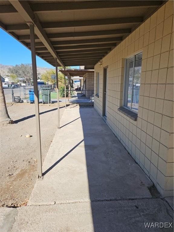 view of patio with an outbuilding and an exterior structure