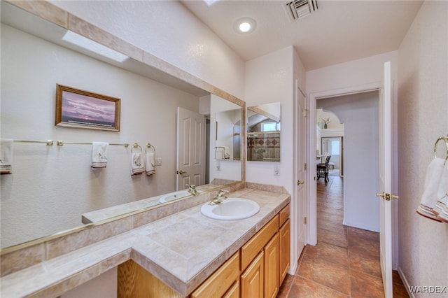 bathroom with visible vents and vanity