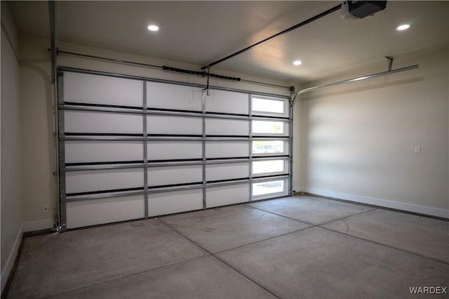 garage featuring baseboards, recessed lighting, and a garage door opener