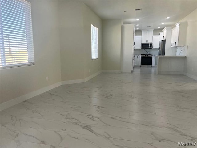 unfurnished living room featuring marble finish floor, recessed lighting, visible vents, and baseboards