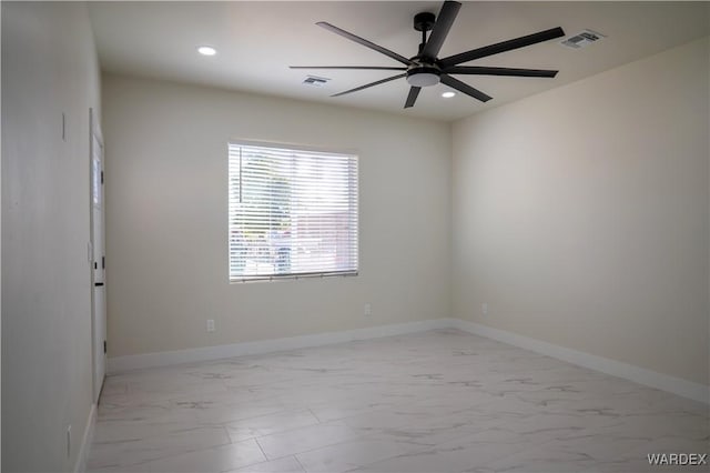 empty room featuring marble finish floor, baseboards, visible vents, and recessed lighting