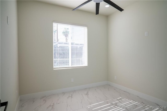 spare room featuring marble finish floor, recessed lighting, a ceiling fan, and baseboards