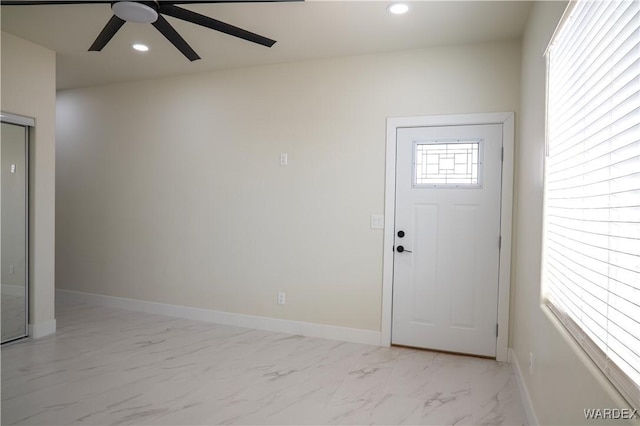 entrance foyer featuring a wealth of natural light, recessed lighting, and marble finish floor