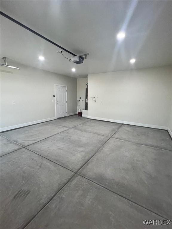 garage featuring baseboards and a garage door opener