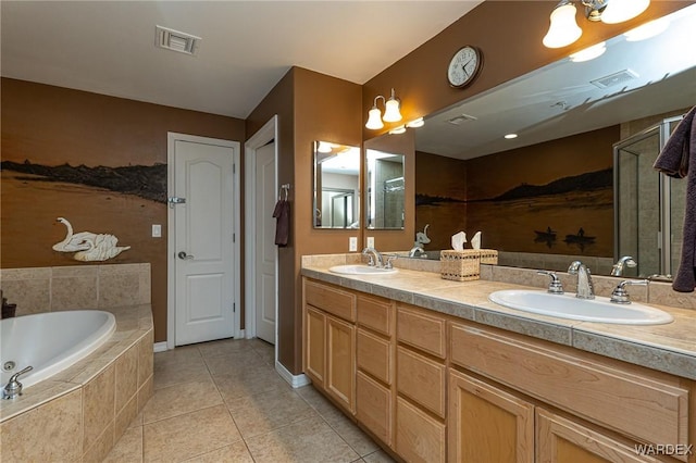 bathroom featuring a closet, a sink, and visible vents