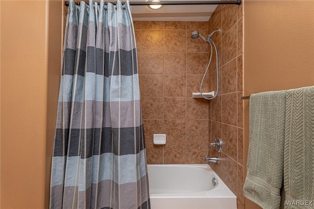 bathroom featuring shower / bathtub combination with curtain