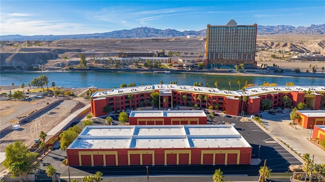 bird's eye view with a water and mountain view