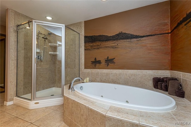 bathroom with tile patterned flooring, a jetted tub, a shower stall, and recessed lighting