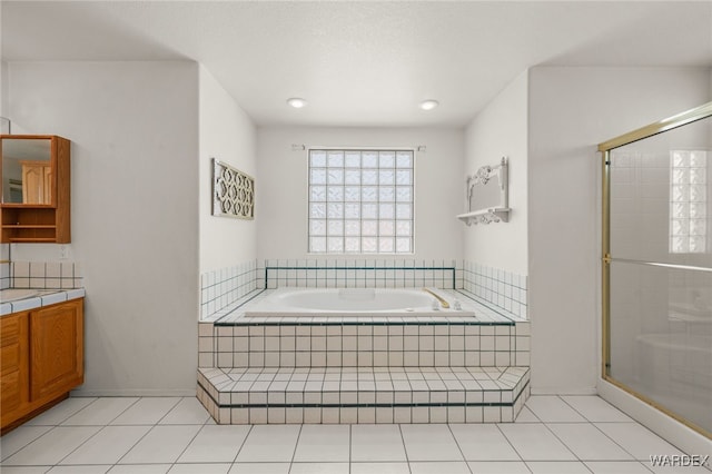 4393 S Colorado Rd, Fort Mohave, AZ 86426 - full bathroom with an enclosed shower, tile patterned floors, a bath, and vanity