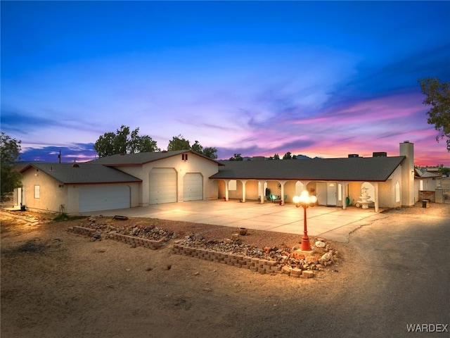 4393 S Colorado Rd, Fort Mohave, AZ 86426 - ranch-style home featuring concrete driveway, stucco siding, and a garage