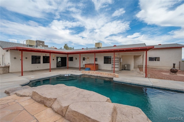 4393 S Colorado Rd, Fort Mohave, AZ 86426 - rear view of property with a hot tub, a patio area, central AC, and an outdoor pool