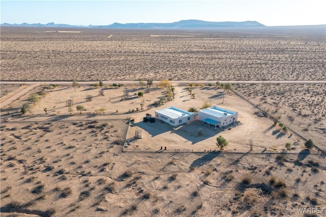 birds eye view of property featuring a mountain view and a desert view