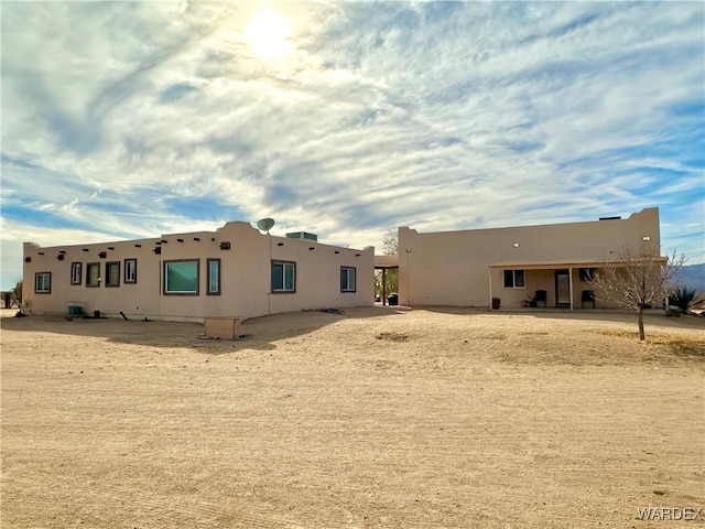 back of property with stucco siding