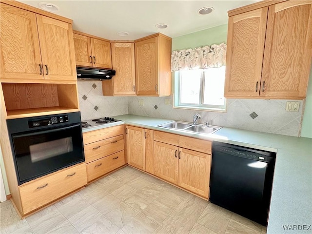 kitchen featuring light brown cabinets, under cabinet range hood, a sink, light countertops, and black appliances