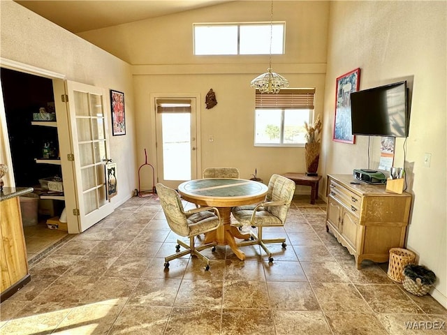 dining space with vaulted ceiling