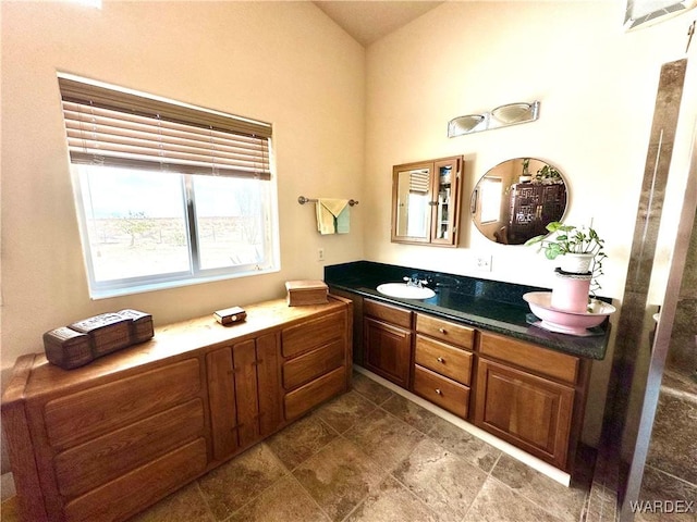 bathroom featuring double vanity and a sink