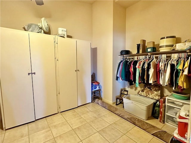 spacious closet with light tile patterned flooring