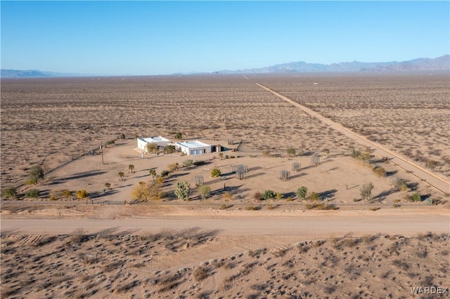 bird's eye view featuring a rural view, a desert view, and a mountain view