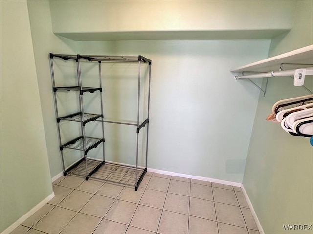 walk in closet featuring light tile patterned floors