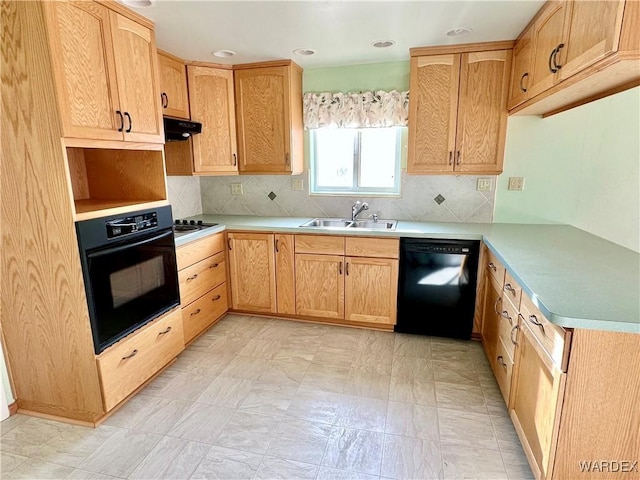 kitchen featuring decorative backsplash, under cabinet range hood, light countertops, black appliances, and a sink