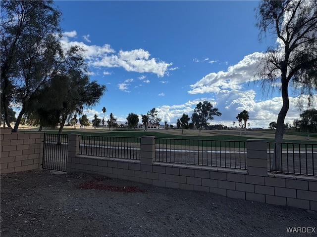 view of gate with fence