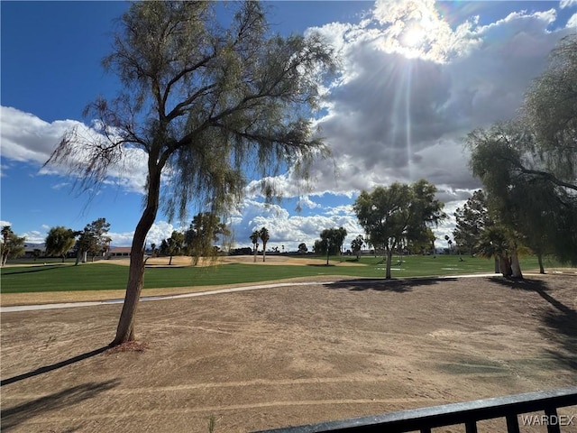 view of property's community featuring a yard