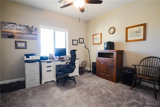 home office with a ceiling fan, light colored carpet, visible vents, and baseboards