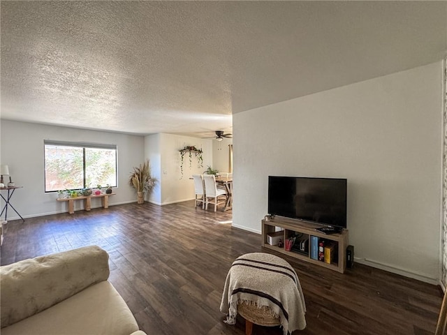 1189 Juanita Ln, Bullhead City, AZ 86442 - living room featuring wood finished floors, ceiling fan, and a textured ceiling