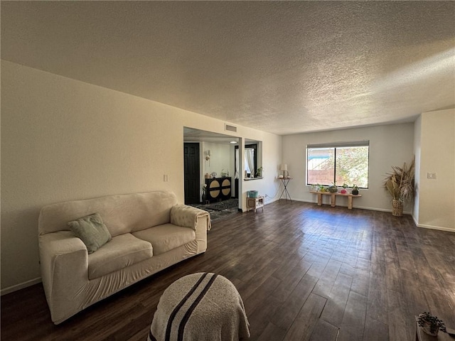 1189 Juanita Ln, Bullhead City, AZ 86442 - living room featuring dark wood finished floors and a textured ceiling