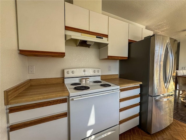 1189 Juanita Ln, Bullhead City, AZ 86442 - kitchen with white electric stove, custom exhaust hood, freestanding refrigerator, a textured ceiling, and white cabinets