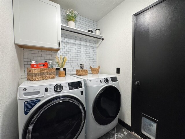 1189 Juanita Ln, Bullhead City, AZ 86442 - laundry room with washer and clothes dryer, cabinet space, and a textured wall