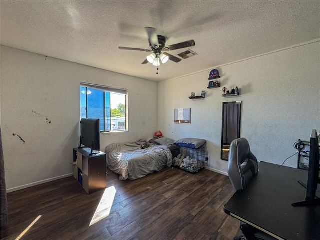 1189 Juanita Ln, Bullhead City, AZ 86442 - bedroom featuring a desk, wood finished floors, a textured ceiling, a ceiling fan, and a textured wall