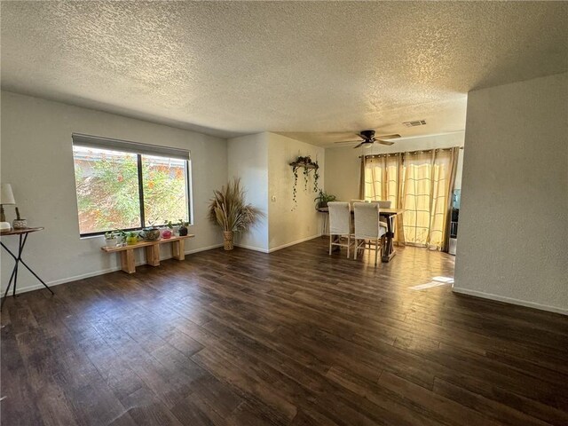 1189 Juanita Ln, Bullhead City, AZ 86442 - living area with a textured ceiling, a ceiling fan, and wood-type flooring