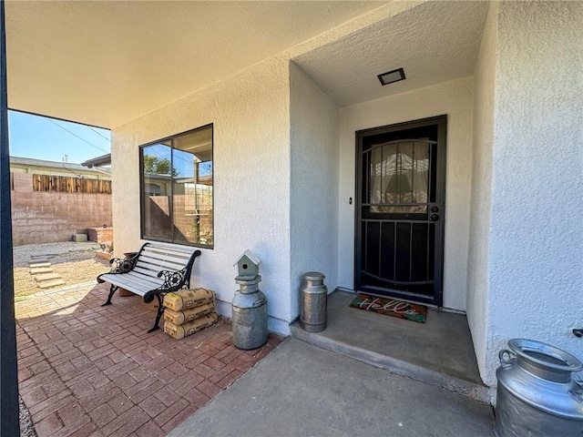 1189 Juanita Ln, Bullhead City, AZ 86442 - property entrance with stucco siding and a patio area