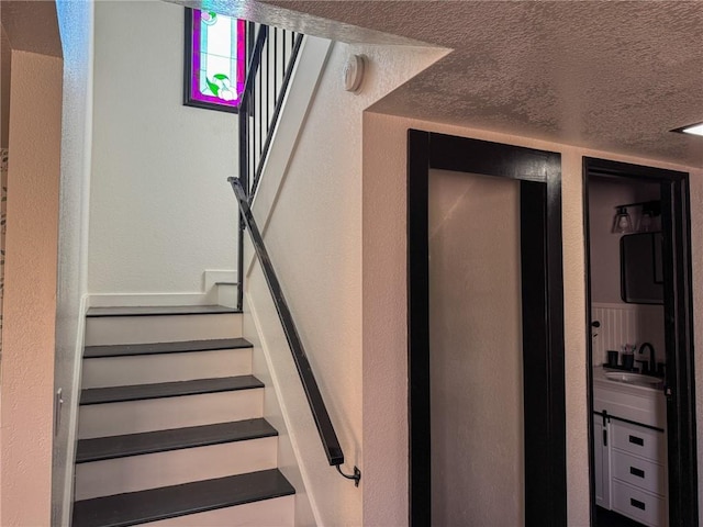 1189 Juanita Ln, Bullhead City, AZ 86442 - staircase with a textured ceiling and a textured wall