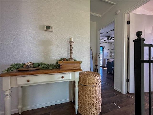 1189 Juanita Ln, Bullhead City, AZ 86442 - hall featuring dark wood-style flooring, a textured wall, and ornamental molding