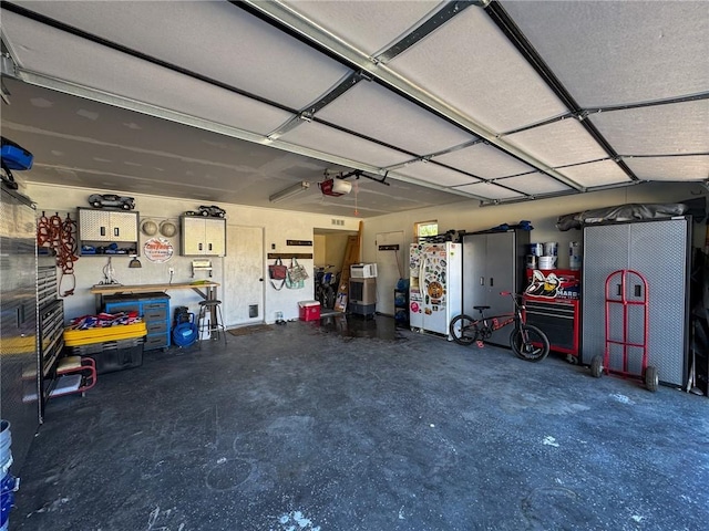 1189 Juanita Ln, Bullhead City, AZ 86442 - garage with a garage door opener and a workshop area